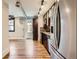 Modern kitchen with stainless steel appliances and hardwood floors at 740 N Sherman St # 107, Denver, CO 80203