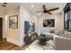 Bright living room with modern decor, comfortable sofa, and decorative ceiling fan at 740 N Sherman St # 107, Denver, CO 80203
