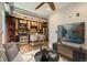 Open concept living room and kitchen with hardwood floors and a ceiling fan at 740 N Sherman St # 107, Denver, CO 80203