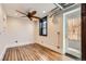 Neutral living room with exposed duct work, ceiling fan, and wood floors at 740 N Sherman St # 107, Denver, CO 80203