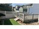 Multi-level deck with view of lush green lawn, white picket fence, and neighboring houses at 3542 W 125Th Dr, Broomfield, CO 80020