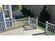 View of backyard from the deck with a gray railing and green turf at 3542 W 125Th Dr, Broomfield, CO 80020