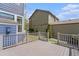 View of deck with gray railing overlooking a yard and the neighbor's home at 3542 W 125Th Dr, Broomfield, CO 80020