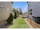 View of a backyard with well-maintained artificial grass, landscaping, and a charming deck at 3542 W 125Th Dr, Broomfield, CO 80020