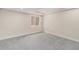 Finished basement showing neutral paint, carpet, recessed lighting, and window at 3542 W 125Th Dr, Broomfield, CO 80020