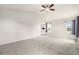 Bright bedroom with a ceiling fan, neutral carpet, and multiple windows offering ample natural light at 3542 W 125Th Dr, Broomfield, CO 80020