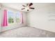 Inviting bedroom with plush carpeting, pink curtains, and sunny windows, perfect for relaxing at 3542 W 125Th Dr, Broomfield, CO 80020