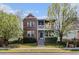 Charming two-story brick home with a lovely front porch and manicured lawn at 3542 W 125Th Dr, Broomfield, CO 80020