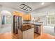 Well-equipped kitchen featuring stainless steel appliances, a center island, and hardwood floors at 3542 W 125Th Dr, Broomfield, CO 80020