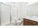 Modern bathroom with a glass-enclosed shower, and dark wood vanity at 20630 E 58Th Ave, Aurora, CO 80019