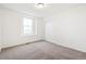 Bright bedroom features neutral carpet, white walls, a large window and sliding door closet at 20630 E 58Th Ave, Aurora, CO 80019