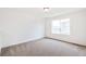 Well-lit bedroom with neutral walls, carpeting and a large window offering natural light at 20630 E 58Th Ave, Aurora, CO 80019
