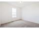 Carpeted bedroom with a bright window at 20630 E 58Th Ave, Aurora, CO 80019