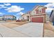 Two-story house features a driveway, two-car garage, stone accents, and two-tone siding at 20630 E 58Th Ave, Aurora, CO 80019