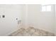 This laundry room has tile floors, white walls, wire shelving and hookups for washer and dryer at 20630 E 58Th Ave, Aurora, CO 80019