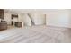 Expansive open-concept living area with a modern kitchen, staircase, and plentiful natural light for a welcoming ambiance at 20630 E 58Th Ave, Aurora, CO 80019
