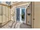 Back porch with sliding glass door entrance to home and adjacent storage area at 11935 E Ford Dr, Aurora, CO 80012