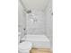 Close-up of bathroom showcasing a bathtub shower with marble tiling at 11935 E Ford Dr, Aurora, CO 80012