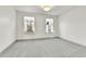 Bright and airy bedroom with two windows and neutral gray carpet at 11935 E Ford Dr, Aurora, CO 80012