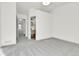 Bedroom featuring a view of the bathroom, closet and gray carpet at 11935 E Ford Dr, Aurora, CO 80012