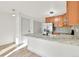 Bright kitchen featuring granite countertops, stainless steel appliances, and modern fixtures at 11935 E Ford Dr, Aurora, CO 80012