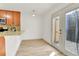 Kitchen with ample counter space and access to the outdoor patio at 11935 E Ford Dr, Aurora, CO 80012