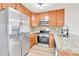 Bright kitchen with stainless steel appliances and granite countertops at 11935 E Ford Dr, Aurora, CO 80012