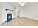 Cozy living room featuring fireplace, wood floors, and staircase at 11935 E Ford Dr, Aurora, CO 80012