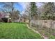Backyard with a well-maintained lawn, mature trees, a gazebo, and a garden shed at 8029 W Hoover Pl, Littleton, CO 80123