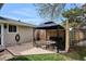 Covered patio area with table, bench and chairs at 8029 W Hoover Pl, Littleton, CO 80123