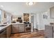 Updated kitchen features stainless steel appliances, gray cabinets, and mosaic backsplash at 8029 W Hoover Pl, Littleton, CO 80123
