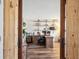 Stylish home office with wood plank sliding doors, built-in shelving, and functional workspace at 8029 W Hoover Pl, Littleton, CO 80123