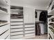Well-organized walk-in closet featuring built-in shelving and ample storage space at 8184 S Ireland Way, Aurora, CO 80016