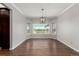 Dining room features hardwood floors and multiple windows with views of the outdoor patio at 8184 S Ireland Way, Aurora, CO 80016