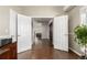 Inviting entryway with hardwood floors and an open view of the home's interior at 8184 S Ireland Way, Aurora, CO 80016