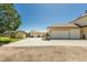 Features multiple garages, including a three car attached garage and an oversized garage in the back at 8184 S Ireland Way, Aurora, CO 80016
