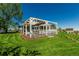 Beautiful home with a large pergola-covered patio perfect for outdoor entertaining on a sprawling green lawn at 8184 S Ireland Way, Aurora, CO 80016