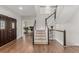 Grand foyer with hardwood floors, staircase, and view into an office space at 8184 S Ireland Way, Aurora, CO 80016