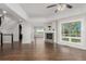 Expansive living room with hardwood floors, fireplace, and open floor plan at 8184 S Ireland Way, Aurora, CO 80016