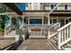 Gourmet outdoor kitchen with stainless steel appliances, barbecue, and ample counter space on a covered patio at 8184 S Ireland Way, Aurora, CO 80016