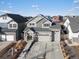 Stunning aerial view of a home with a well-manicured lawn and a spacious driveway at 21901 E 42Nd Place, Aurora, CO 80019