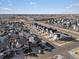 Aerial view of the community showcasing rows of single-Gathering homes and roadways at 21901 E 42Nd Place, Aurora, CO 80019