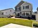 Spacious backyard with a well-kept lawn, patio for relaxing, and perfect for outdoor living at 21901 E 42Nd Place, Aurora, CO 80019