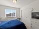 Cozy bedroom with window view, closet, and adjacent dresser at 21901 E 42Nd Place, Aurora, CO 80019