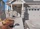 Inviting front entrance with stone accents and a covered porch for a welcoming appeal at 21901 E 42Nd Place, Aurora, CO 80019