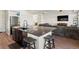 Open kitchen design with a central island and breakfast bar, connecting to the living area at 21901 E 42Nd Place, Aurora, CO 80019