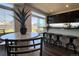 Bright kitchen features a breakfast nook, sliding glass door, and modern appliances at 21901 E 42Nd Place, Aurora, CO 80019
