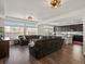 Spacious living room flows into the kitchen creating the perfect gathering space at 21901 E 42Nd Place, Aurora, CO 80019