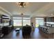Open-concept living room and kitchen with hardwood floors and recessed lighting at 21901 E 42Nd Place, Aurora, CO 80019