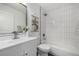 Contemporary bathroom featuring a vanity, commode, and a bathtub with tile surround at 4752 E 108Th Pl, Thornton, CO 80233